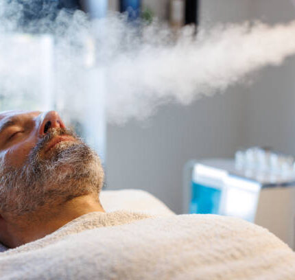 Beauty treatment of face with ozone facial steamer in beauty center.